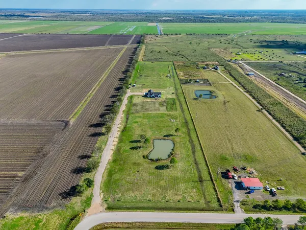 a view of swimming pool with a garden and seating area