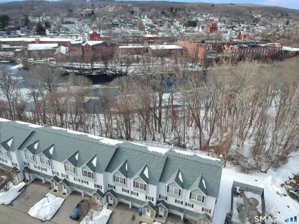 an aerial view of a house with a lake view