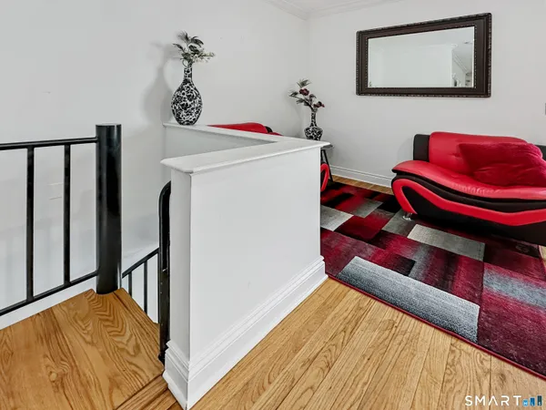 a bathroom with a sink and mirror with toilet
