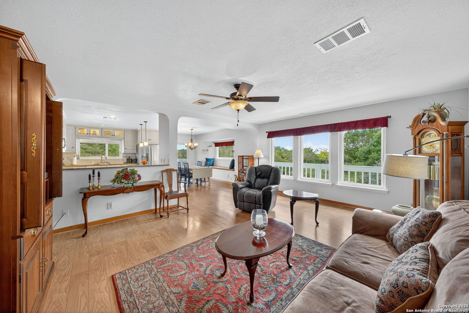 175 Forest Oaks Lane Lakehills, TX 78063 - Photo 2 of 36 a living room with furniture and a large window
