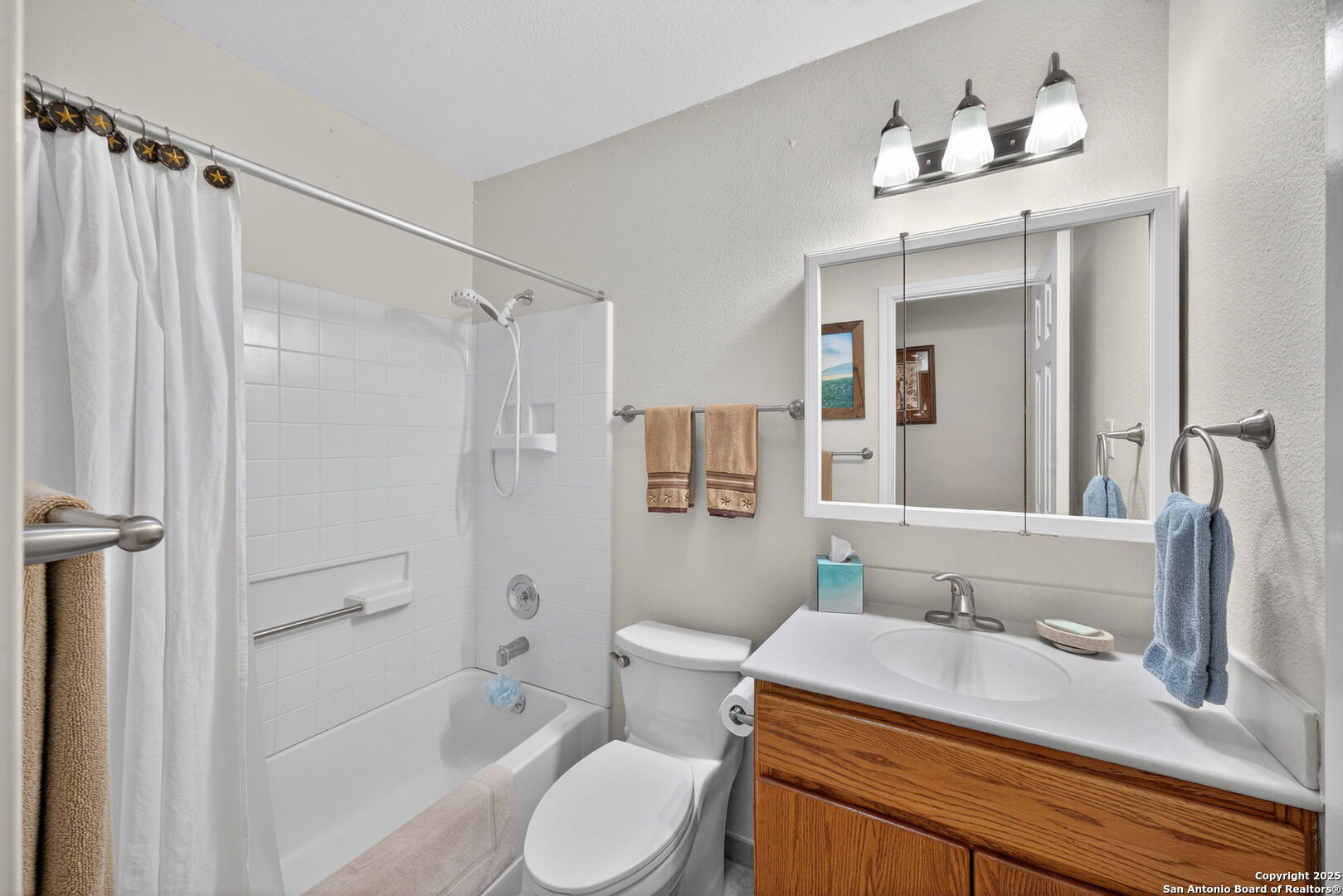 175 Forest Oaks Lane Lakehills, TX 78063 - Photo 22 of 36 a bathroom with a granite countertop sink toilet and shower