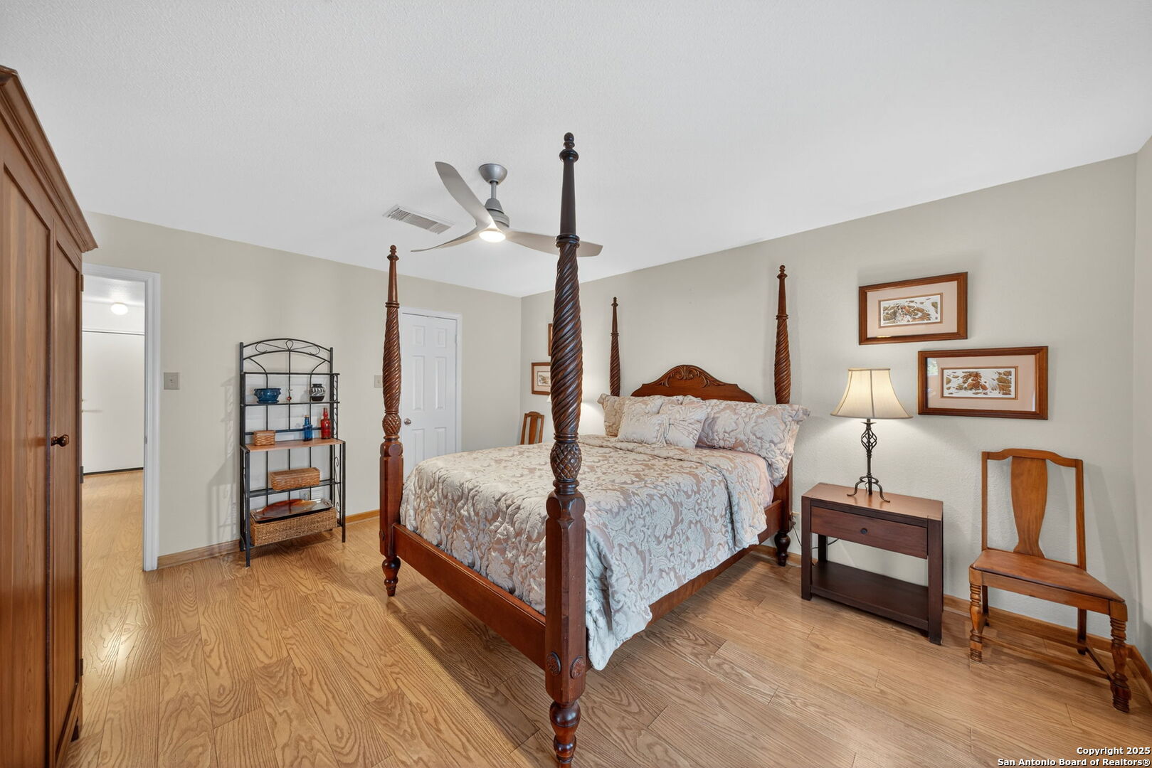 175 Forest Oaks Lane Lakehills, TX 78063 - Photo 23 of 36 a bedroom with a bed and a view of living room