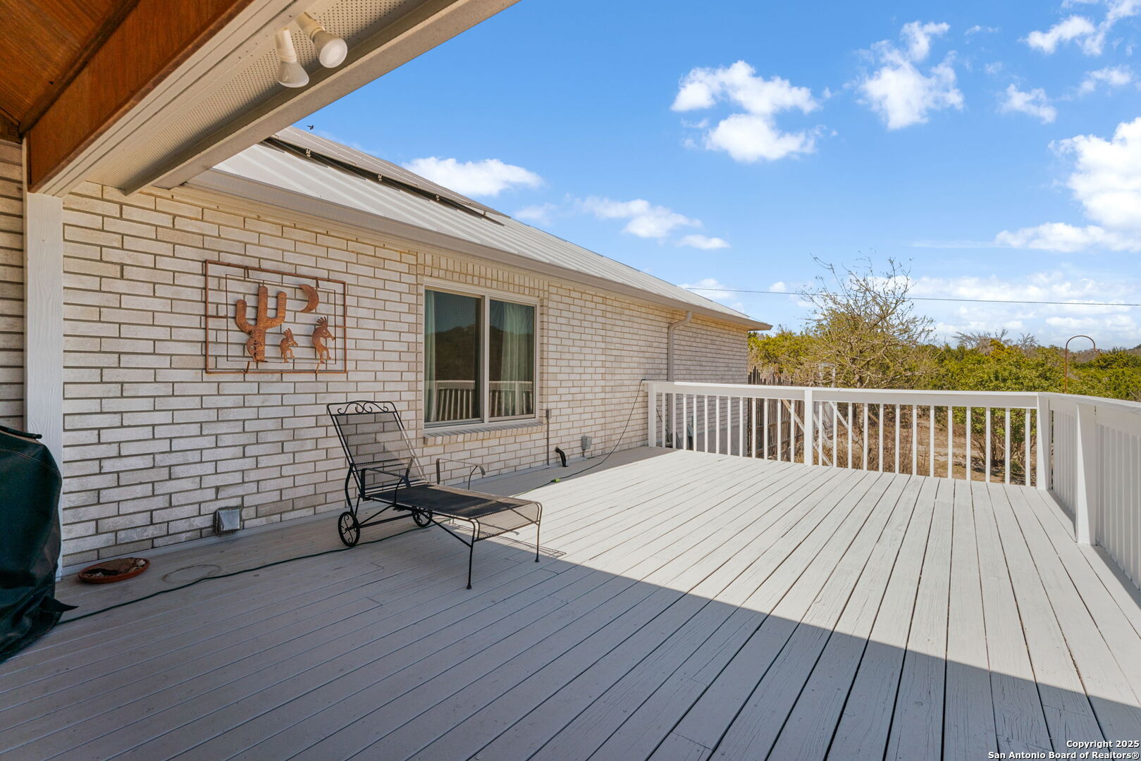175 Forest Oaks Lane Lakehills, TX 78063 - Photo 26 of 36 a view of deck with a table and chairs and wooden floor