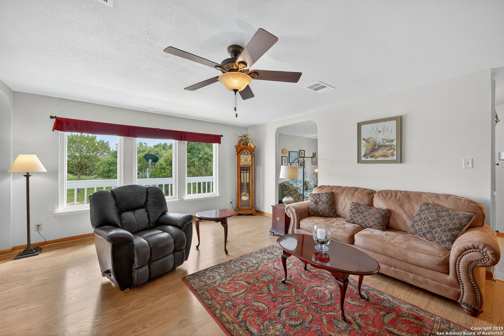 175 Forest Oaks Lane Lakehills, TX 78063 - Photo 7 of 36 a living room with furniture and a large window