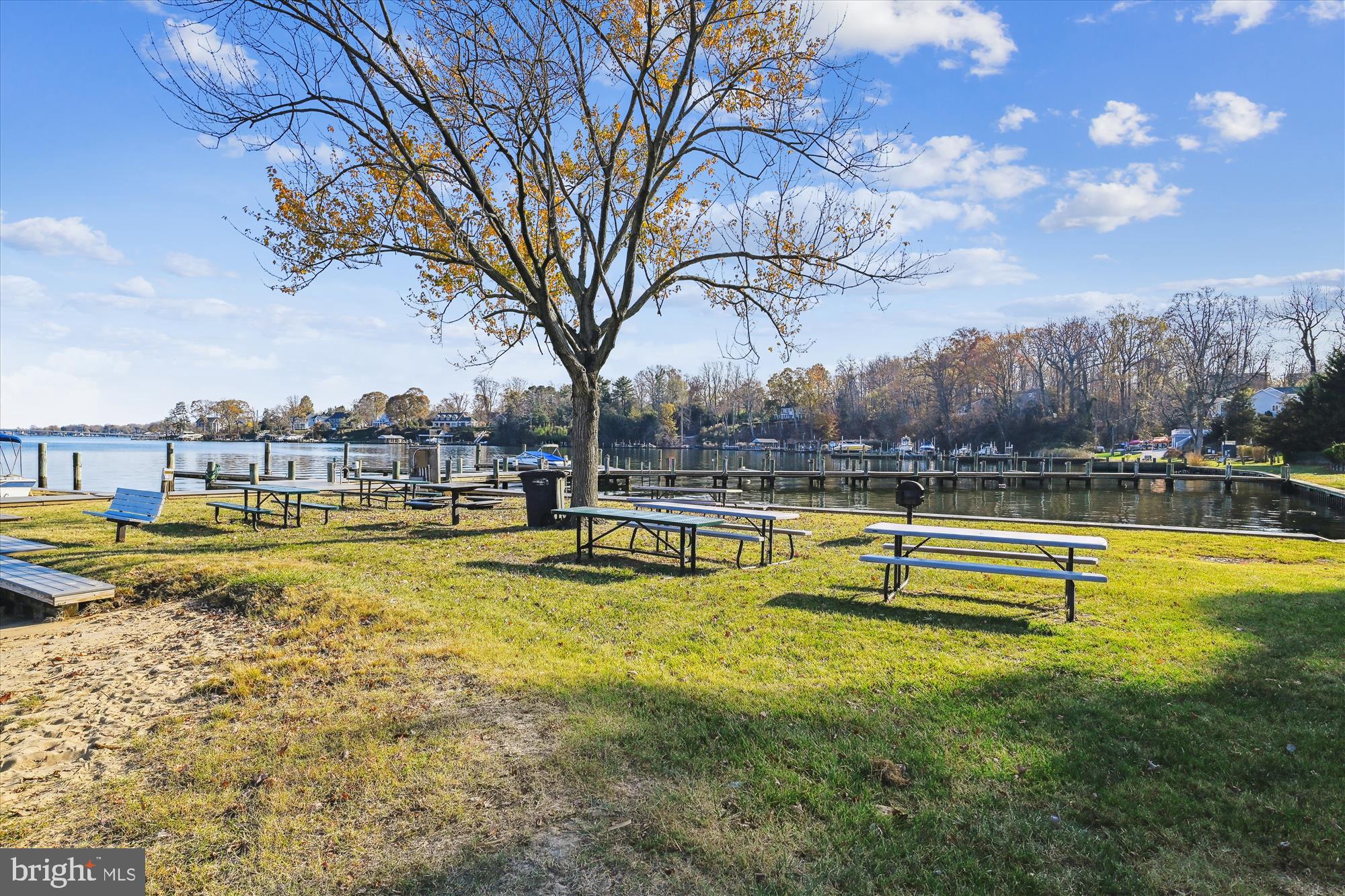 507 Walnut Drive Riva, MD 21140 - Photo 8 of 9 a view of a swimming pool with a lawn chairs under an umbrella
