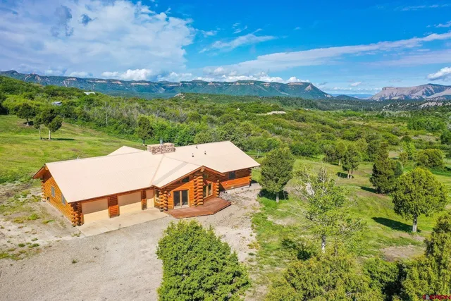 an aerial view of a house with a garden