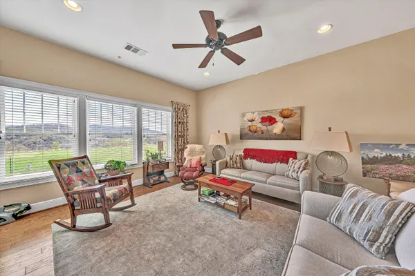 a living room with furniture and a large window