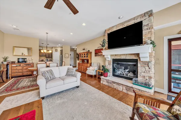 a living room with furniture and a fireplace