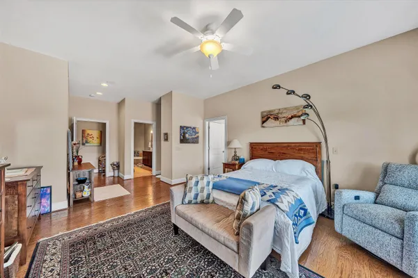 a bedroom with furniture and a window