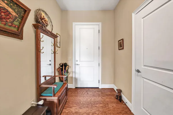 a view of an entryway with wooden floor