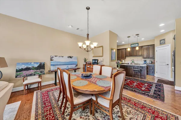 a living room with dining room and kitchen view