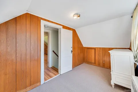 a view of an empty room with windows