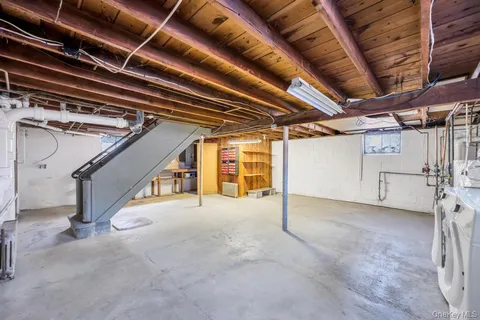 a view of an empty room with white walls