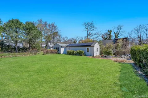 a view of a garden with houses