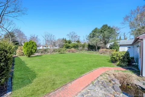 a backyard of a house with lots of green space