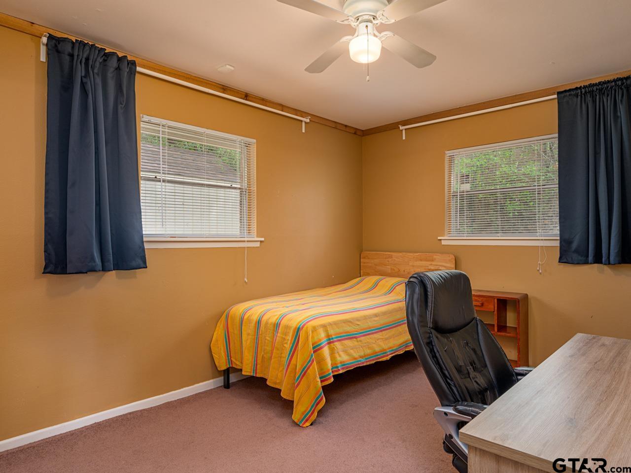 2722 McDonald Road Tyler, TX 75701 - Photo 14 of 28 a bedroom with a bed and window