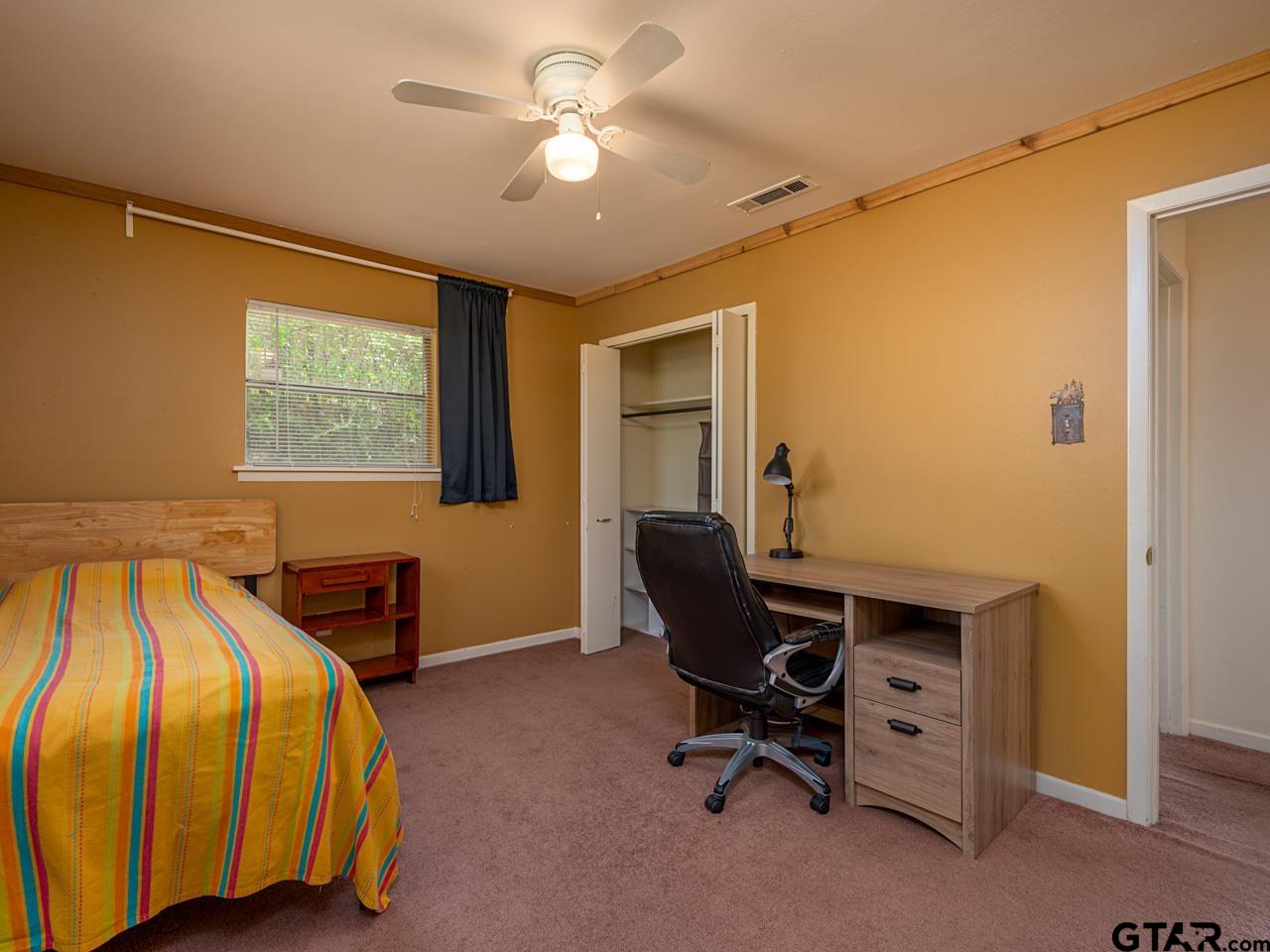 2722 McDonald Road Tyler, TX 75701 - Photo 15 of 28 a bedroom with bed and a window