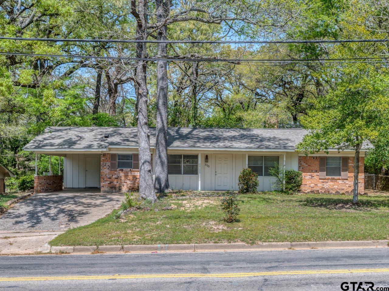 2722 McDonald Road Tyler, TX 75701 - Photo 2 of 28 a front view of a house with garden