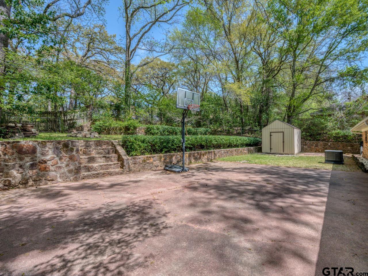 2722 McDonald Road Tyler, TX 75701 - Photo 25 of 28 a view of a yard with a house and large tree