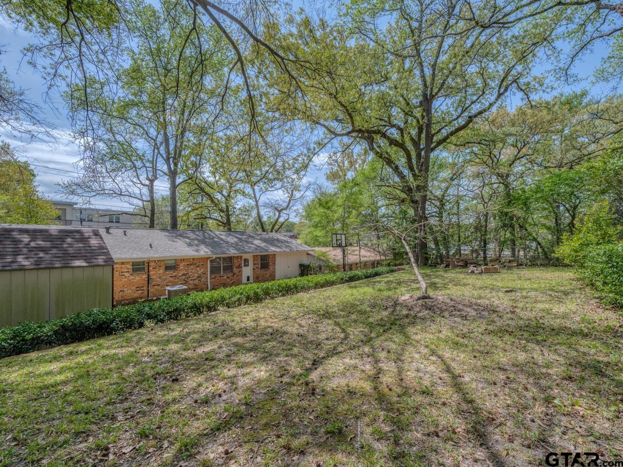 2722 McDonald Road Tyler, TX 75701 - Photo 26 of 28 a view of a house with a yard