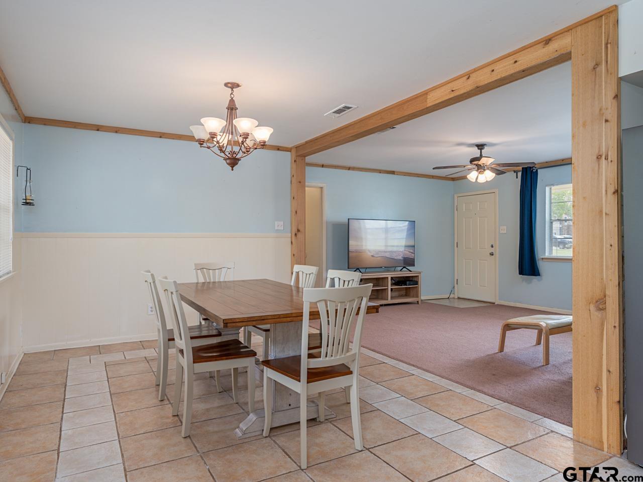 2722 McDonald Road Tyler, TX 75701 - Photo 9 of 28 a view of a dining room with furniture and a chandelier