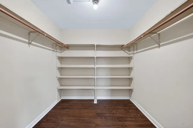a view of a room with shelf on the wall