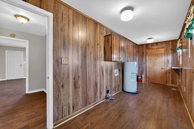 a view of hallway with wooden floor