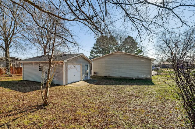 a view of a house with a yard covered with snow in the outdoor