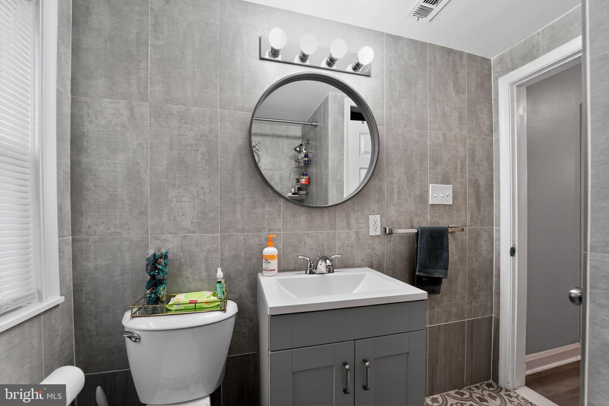 1371 East Northern Parkway Baltimore, MD 21239 - Photo 12 of 29 Modern bathroom with sleek finishes.