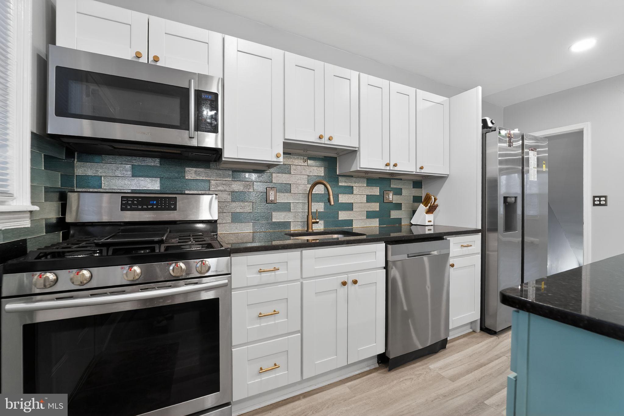 1371 East Northern Parkway Baltimore, MD 21239 - Photo 2 of 29 Modern kitchen with stylish tile accents.