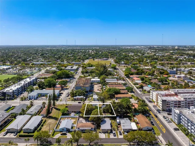 an aerial view of a city with lots of residential buildings