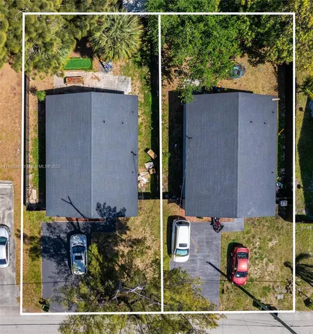 an aerial view of house with yard