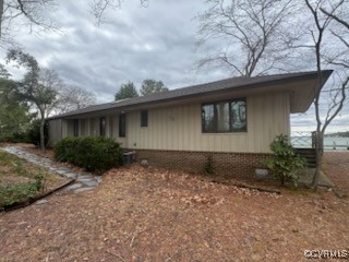 791 Stove Point Road Deltaville, VA 23043 - Photo 2 of 4 a front view of house with yard