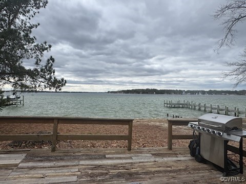 791 Stove Point Road Deltaville, VA 23043 - Photo 4 of 4 a view of a lake with a terrace