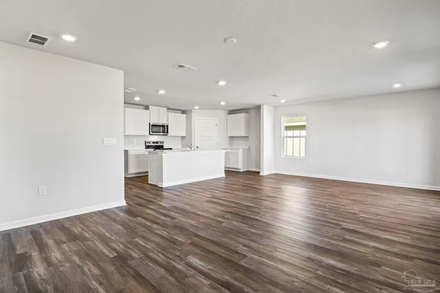 a view of kitchen with wooden floor