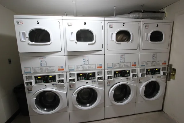 a view of a porch with a table and chairs