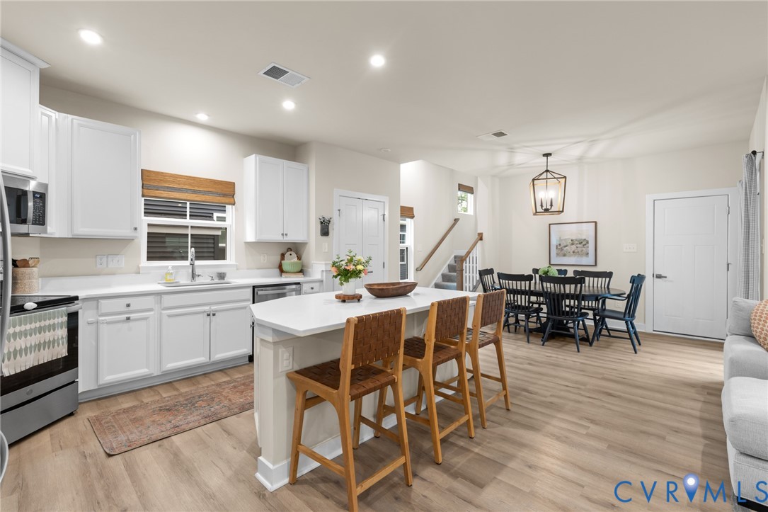 6504 Kinns Road Richmond, VA 23225 - Photo 12 of 34 Open-concept kitchen and dining area with wood-fin
