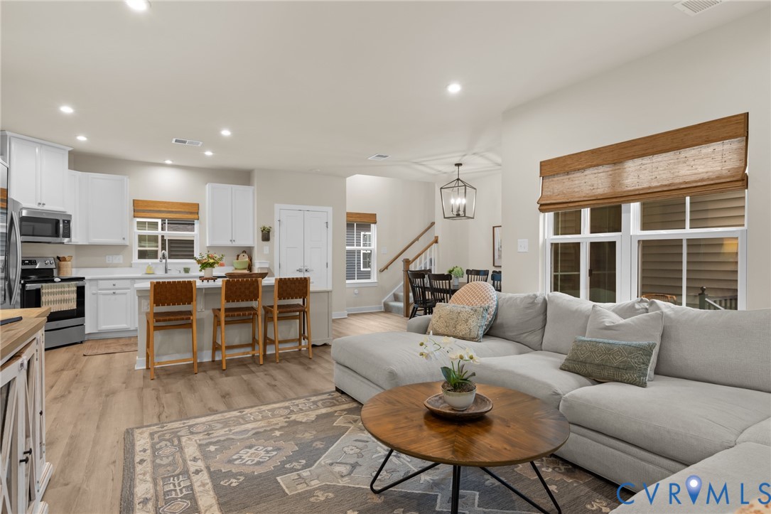 6504 Kinns Road Richmond, VA 23225 - Photo 17 of 34 Open-concept living space featuring wood-finish fl