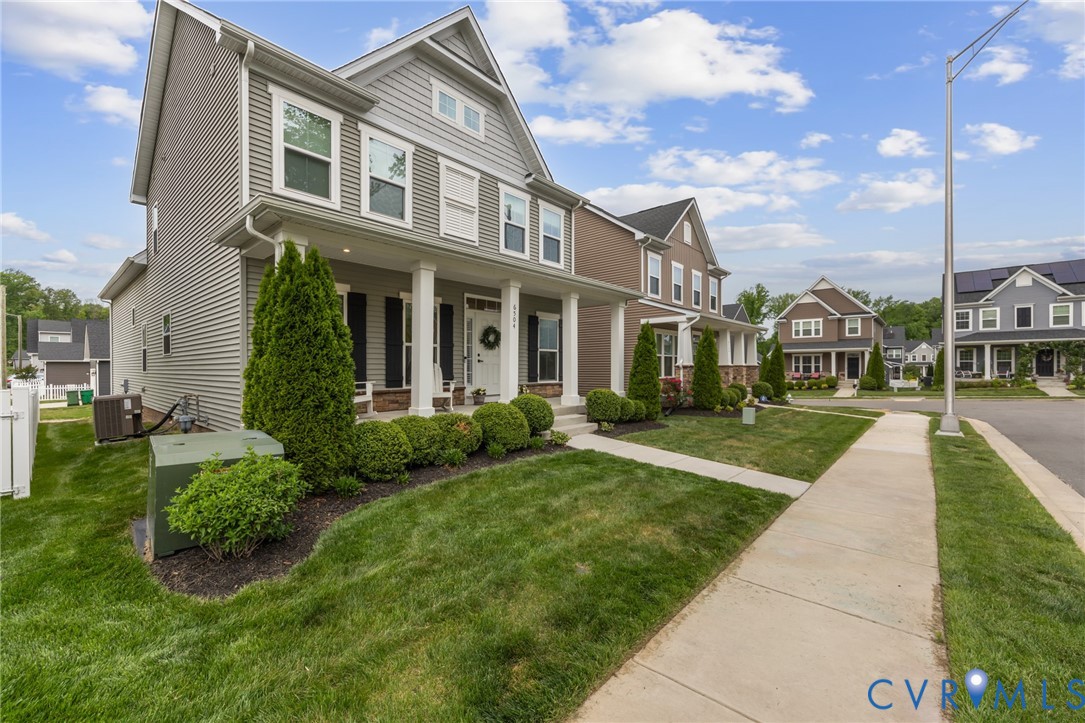 6504 Kinns Road Richmond, VA 23225 - Photo 2 of 34 Gray siding exterior featuring white trim and blac