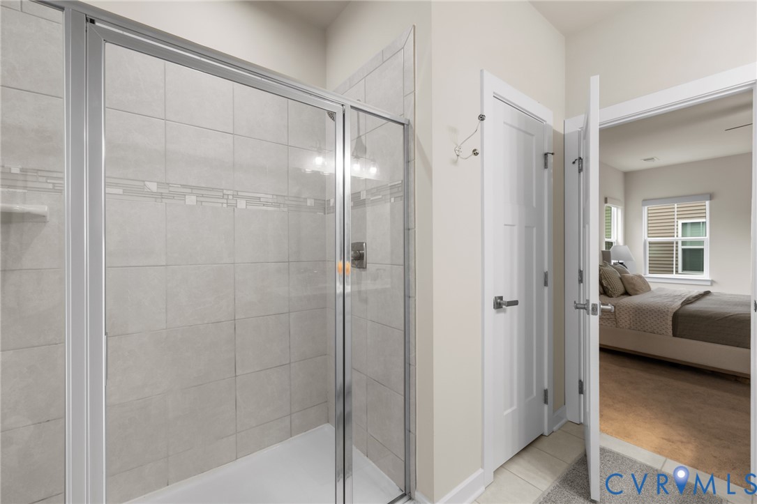6504 Kinns Road Richmond, VA 23225 - Photo 25 of 34 Glass-enclosed shower featuring light grey subway