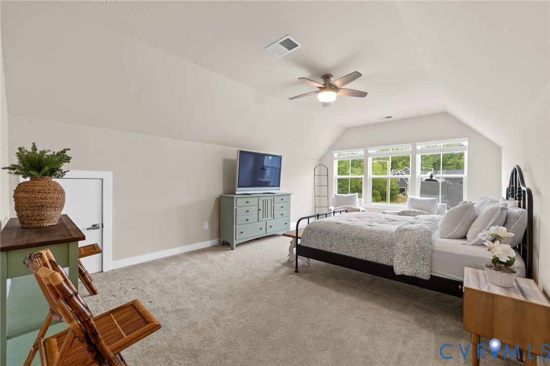 6504 Kinns Road Richmond, VA 23225 - Photo 28 of 34 Carpeted attic room featuring a vaulted ceiling wi