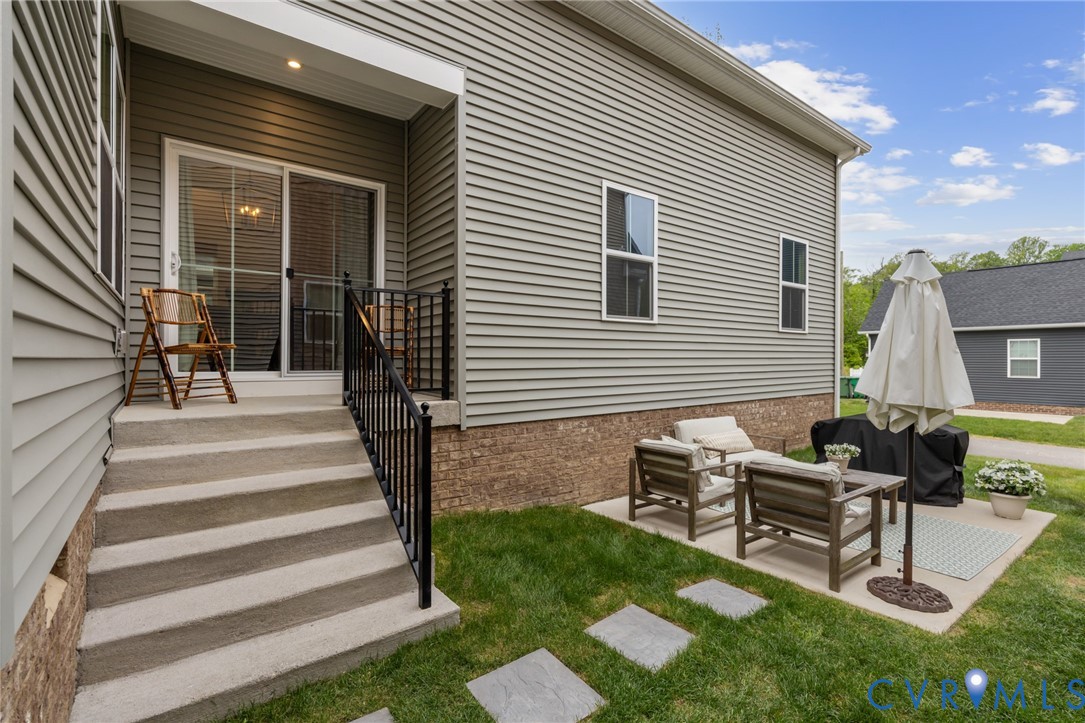 6504 Kinns Road Richmond, VA 23225 - Photo 31 of 34 Rear exterior featuring gray horizontal siding and