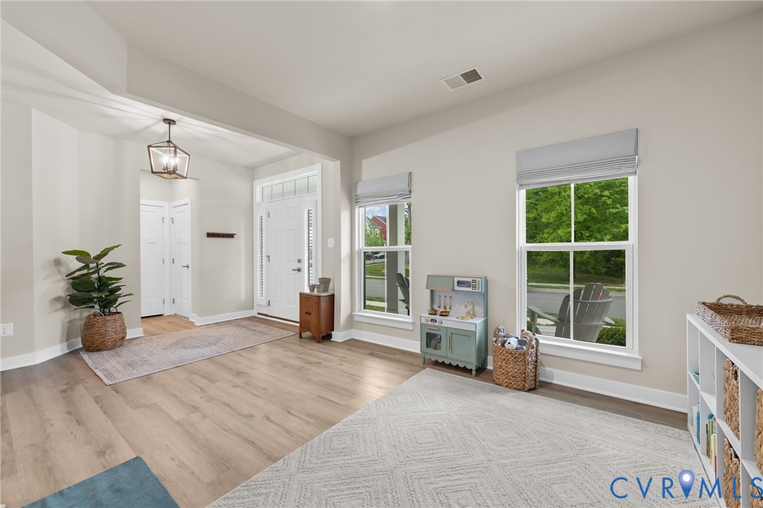 6504 Kinns Road Richmond, VA 23225 - Photo 7 of 34 Open-concept living area featuring wood-finish flo
