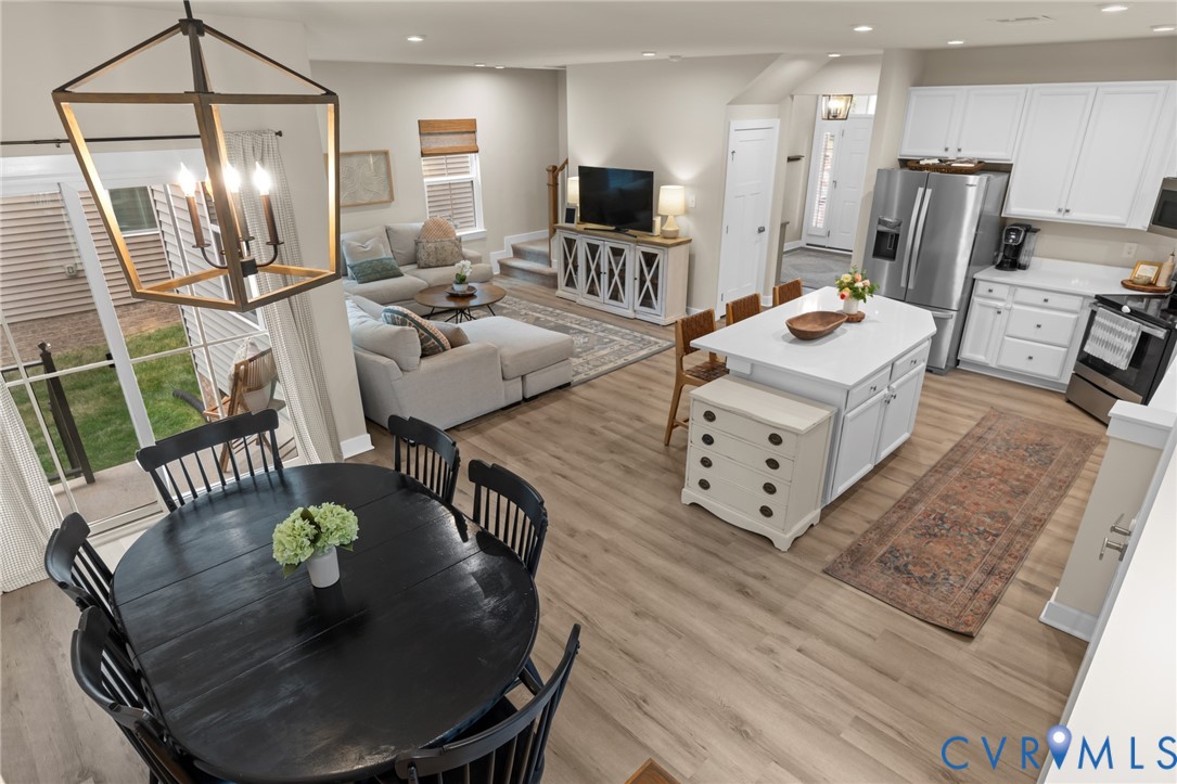 6504 Kinns Road Richmond, VA 23225 - Photo 10 of 34 Open-concept living space featuring wood-finish fl