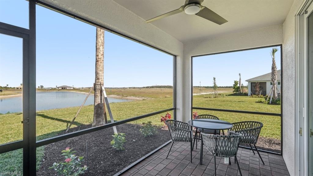 17584 Shade Tree Loop Punta Gorda, FL 33982 - Photo 21 of 35 Screened patio featuring a paved surface, recessed lighting, and a ceiling fan