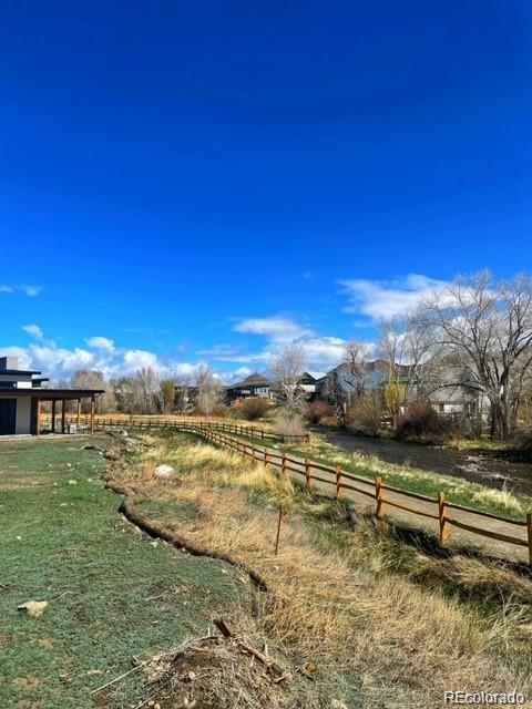 111 Southside Loop Salida, CO 81201 - Photo 12 of 15 a view of a lake with houses in the background