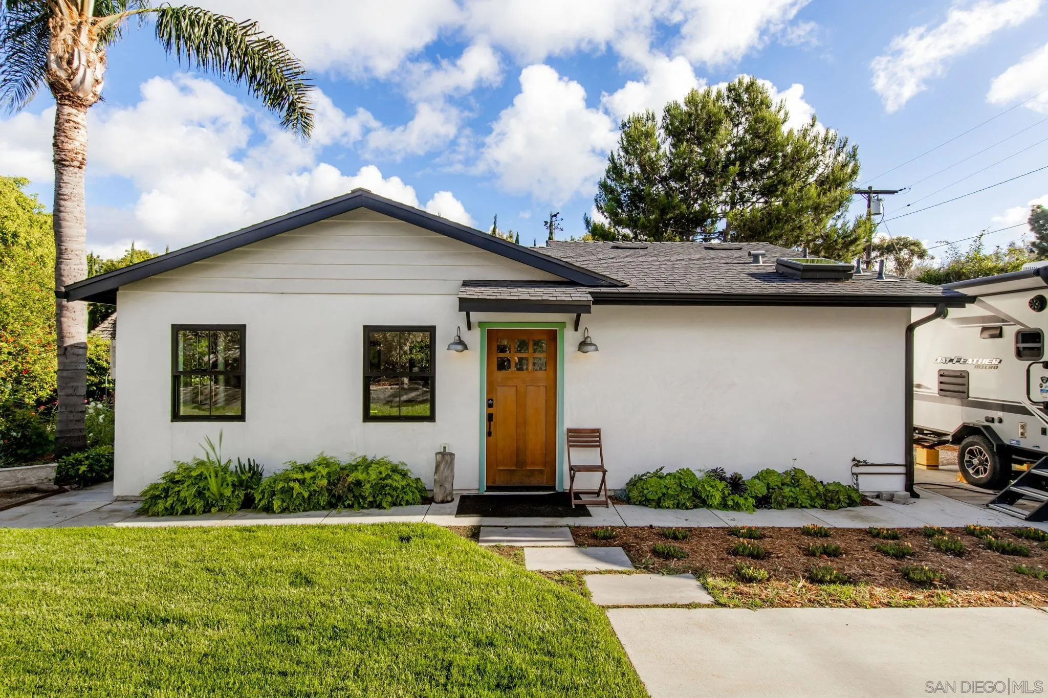 2335 Ivy Road Oceanside, CA 92054 - Photo 36 of 53 a front view of a house with garden