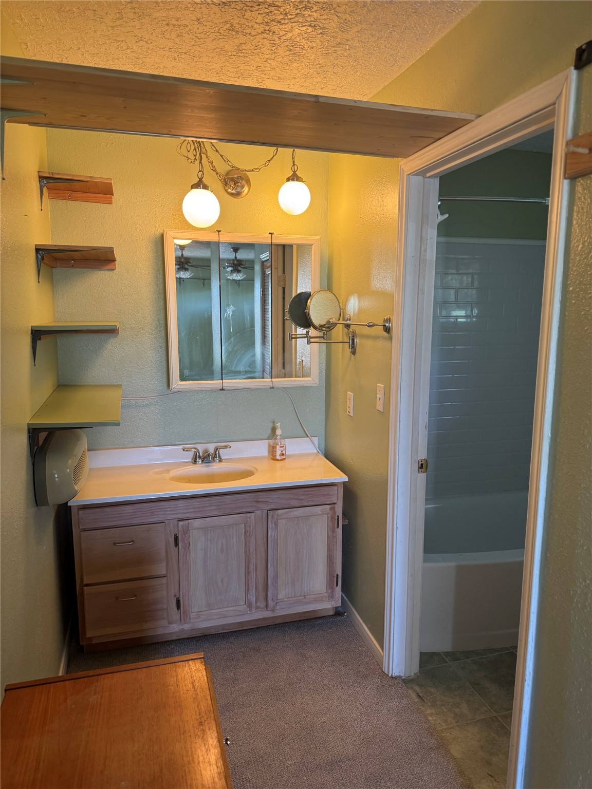 3934 Fernwood Drive, Unit A Houston, TX 77021 - Photo 6 of 10 a bathroom with a tub mirror and sink