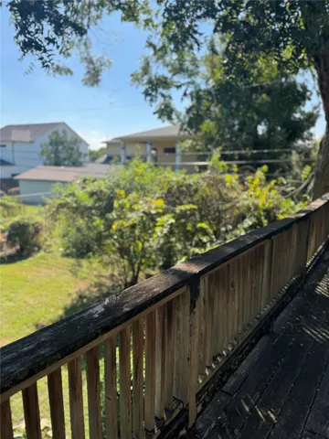 a view of a garden from a balcony