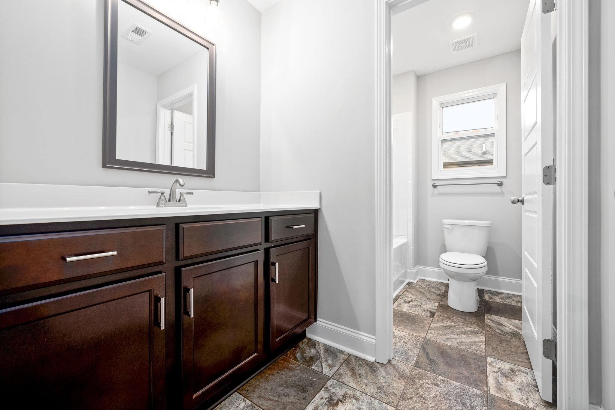 202 Copeland Road Clarksville, TN 37042 - Photo 16 of 19 a bathroom with a sink a toilet and a mirror